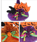 Colorful Halloween pumpkin hat with bats, ribbons, and festive decorations for pets.